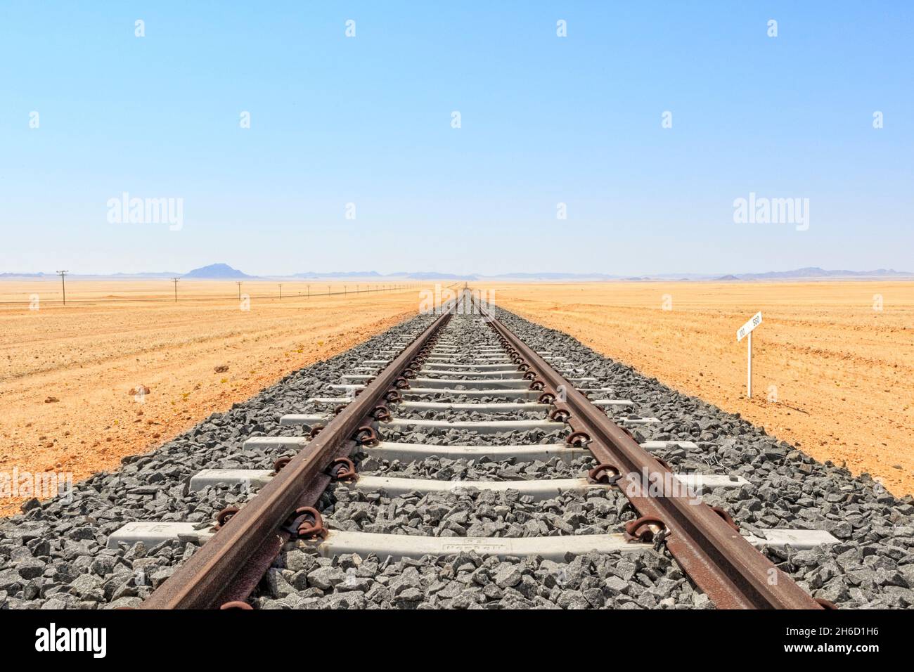 Train tracks going through the desert. Namibia Stock Photo