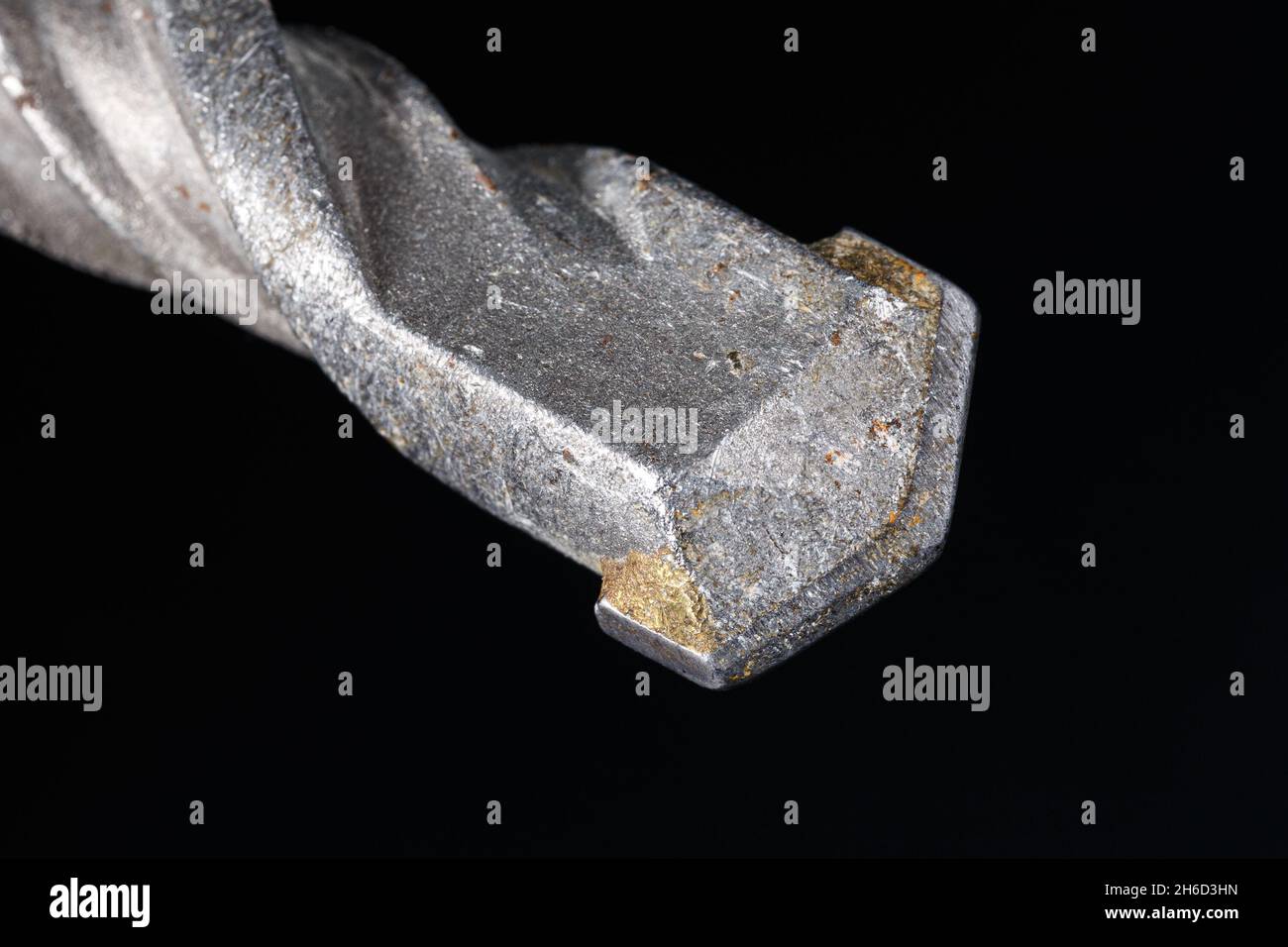 Concrete drill with carbide insert. Close-up on dark background Stock Photo