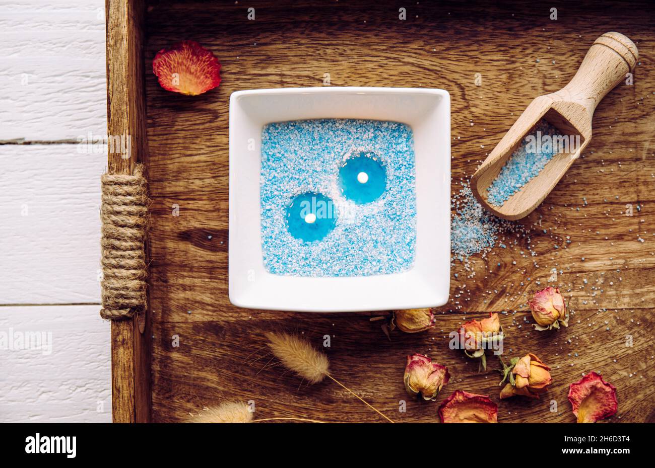 Blue and white granulated wax crystals to create candles by pouring in