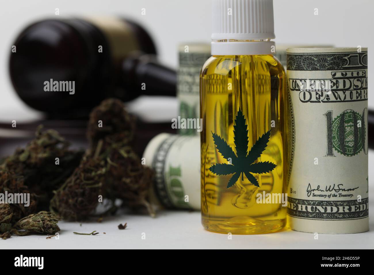 Cannabis extract oil banknotes and gavel as legalization of marijuana Stock Photo