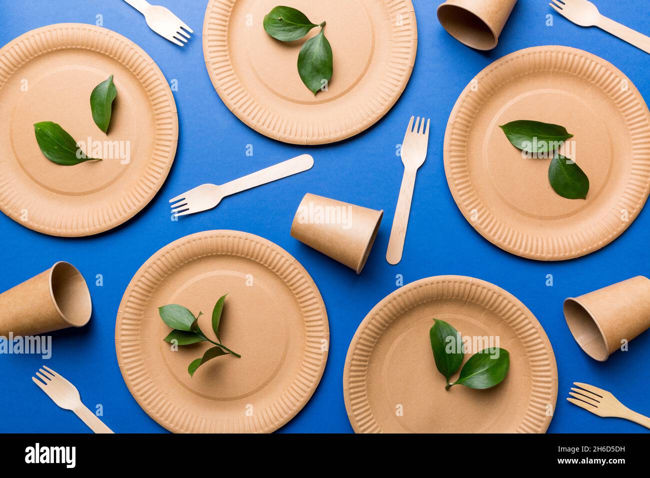 set of empty reusable disposable eco-friendly plates, cups, utensils on  light white colored table background. top view. Biodegradable craft dishes.  Re Stock Photo - Alamy