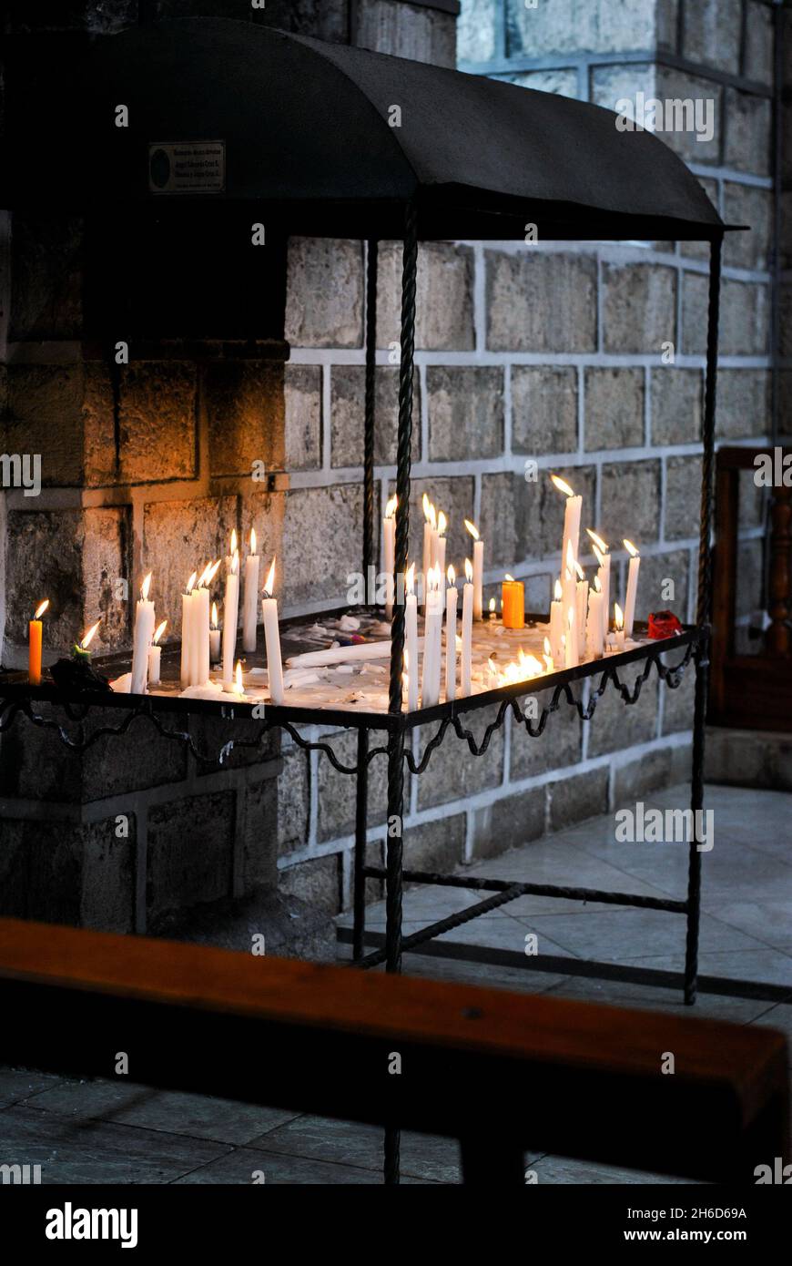 Candles in a church.  San Jose de Chimbo church.   Chimborazo, Ecuador Stock Photo