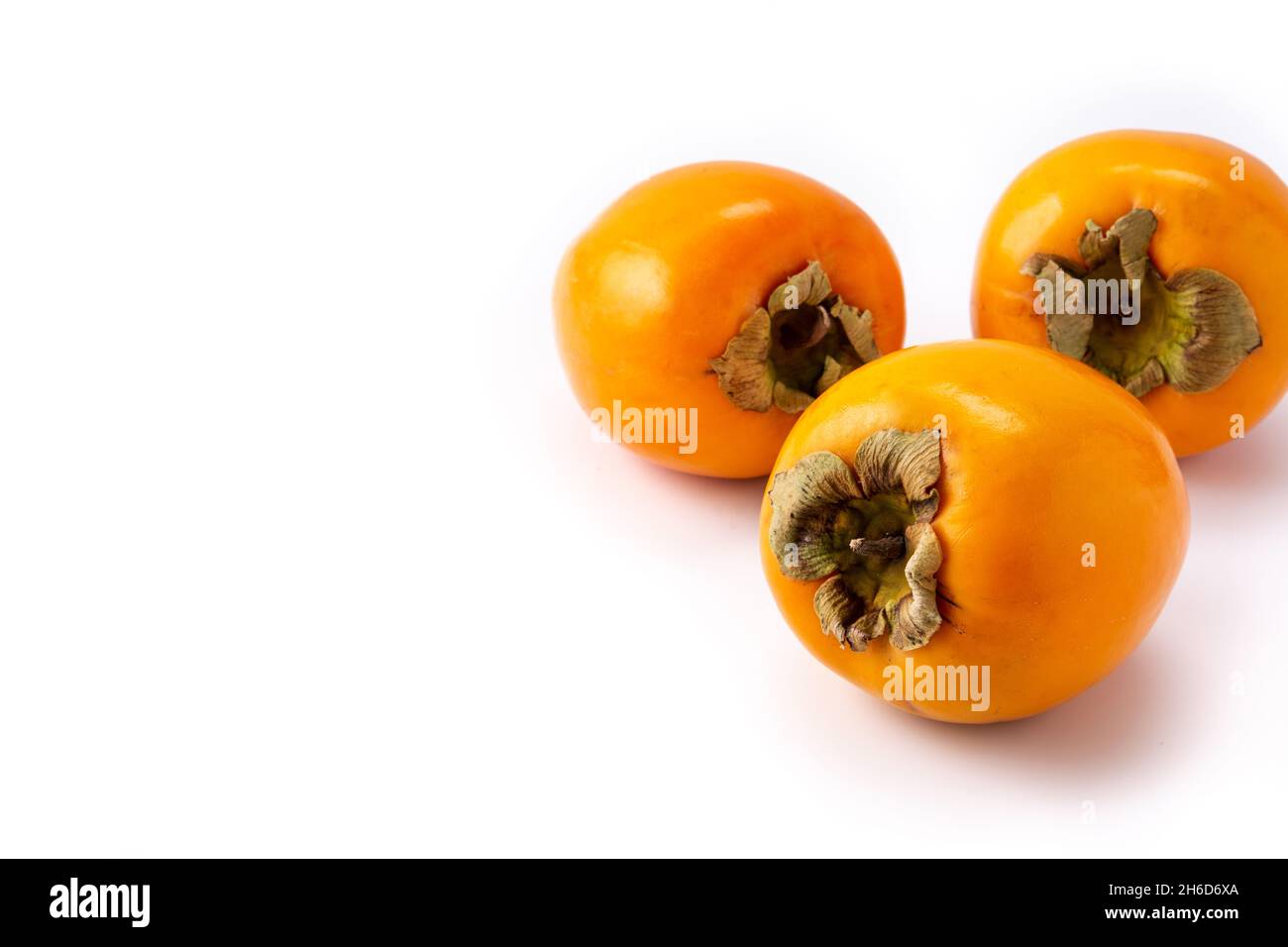 Fresh persimmon fruit isolated on white background Stock Photo
