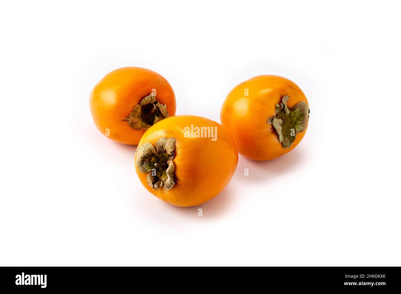 Fresh persimmon fruit isolated on white background Stock Photo