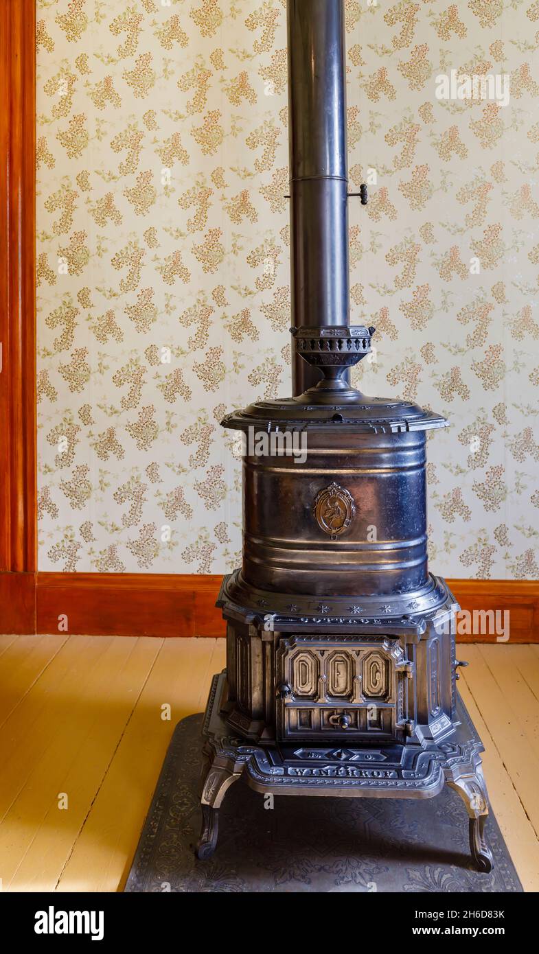 Antique black Winthrop stove heater in the 1890 Farm House museum at Billings Farm & Museum, Woodstock, Vermont, New England, USA Stock Photo