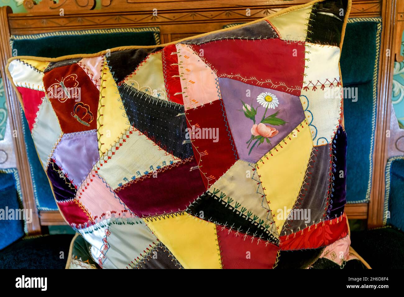 Crazy patchwork cushion on a chair in the 1890 Farm House Museum, Billings Farm & Museum, Woodstock, Vermont, New England, USA Stock Photo