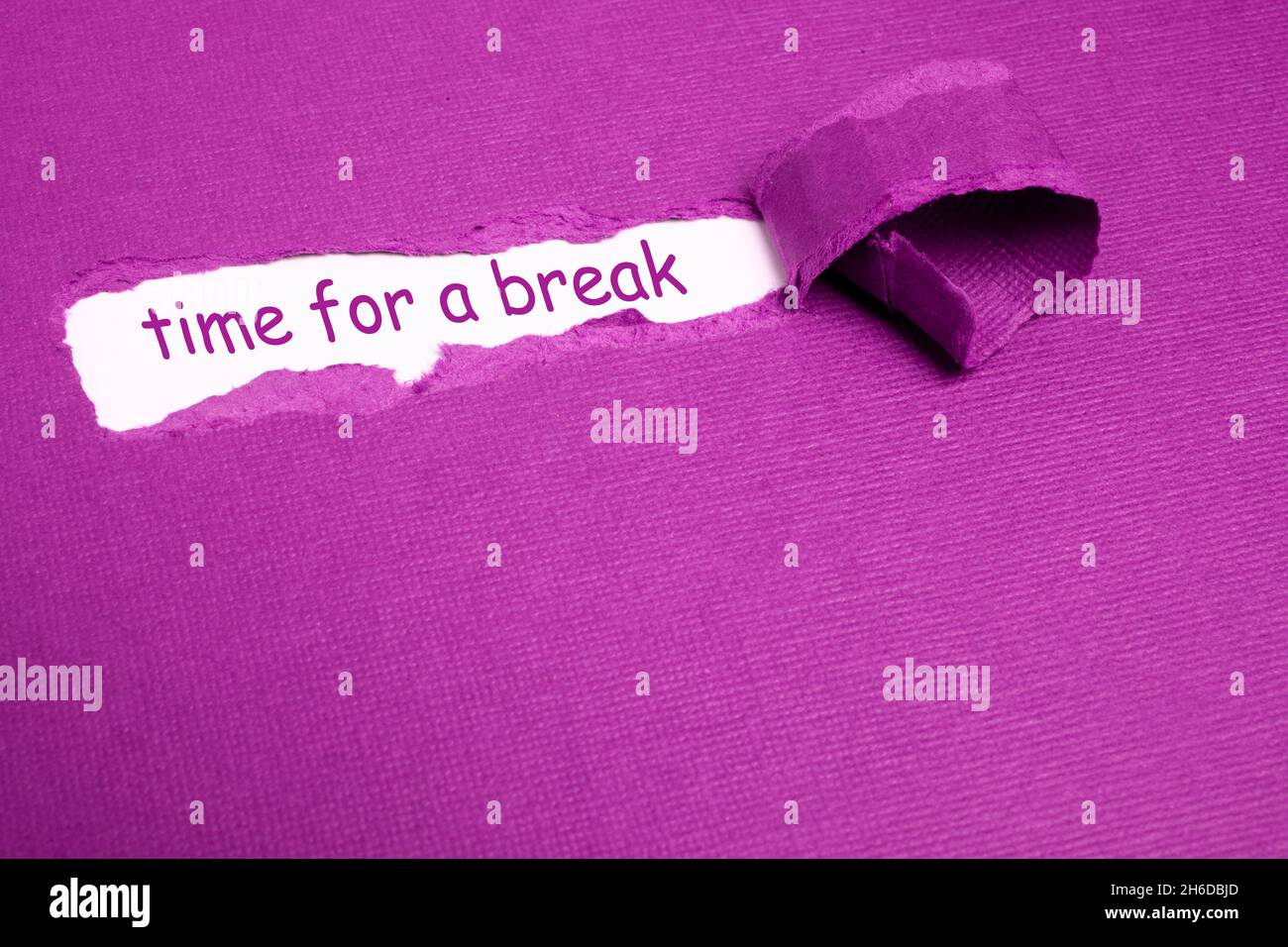 The text TIME TO BREAK appearing behind torn purple paper Stock Photo