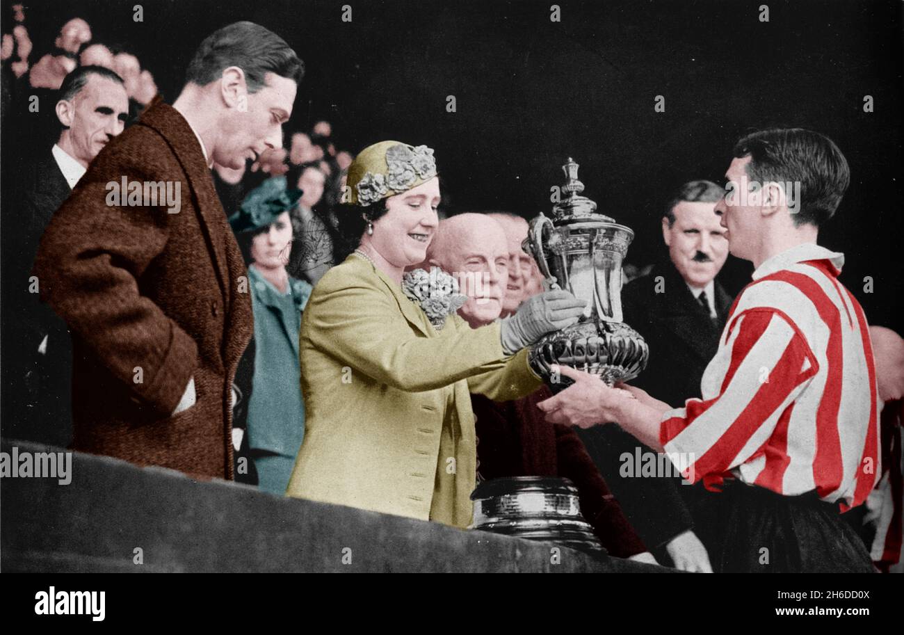 'The Queen Presents The Cup', 1937. From &quot;The Sphere - Coronation Record Number&quot;. [The Sphere, London, 1937]. (Colorised black and white print). Stock Photo