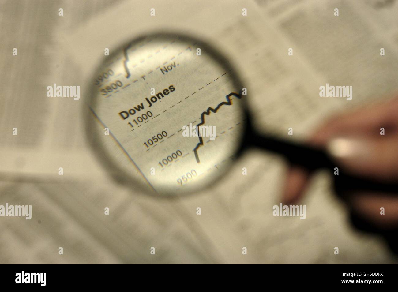 Reading newspaper magnifying glass hires stock photography and images