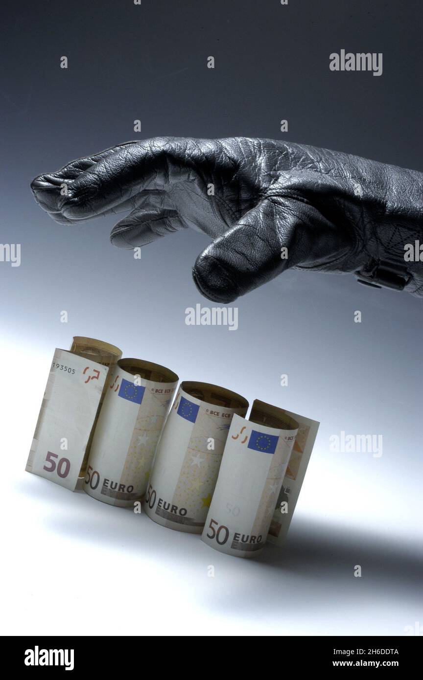 hand in  cloth.leather glove reaching for Euro bills, Germany Stock Photo