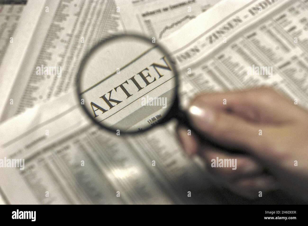 Reading newspaper magnifying glass hires stock photography and images