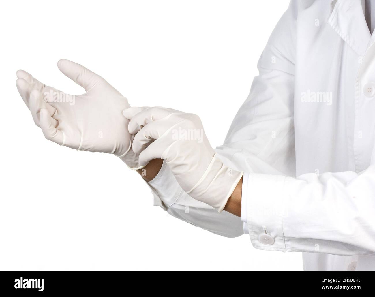doctor putting on latex gloves Stock Photo