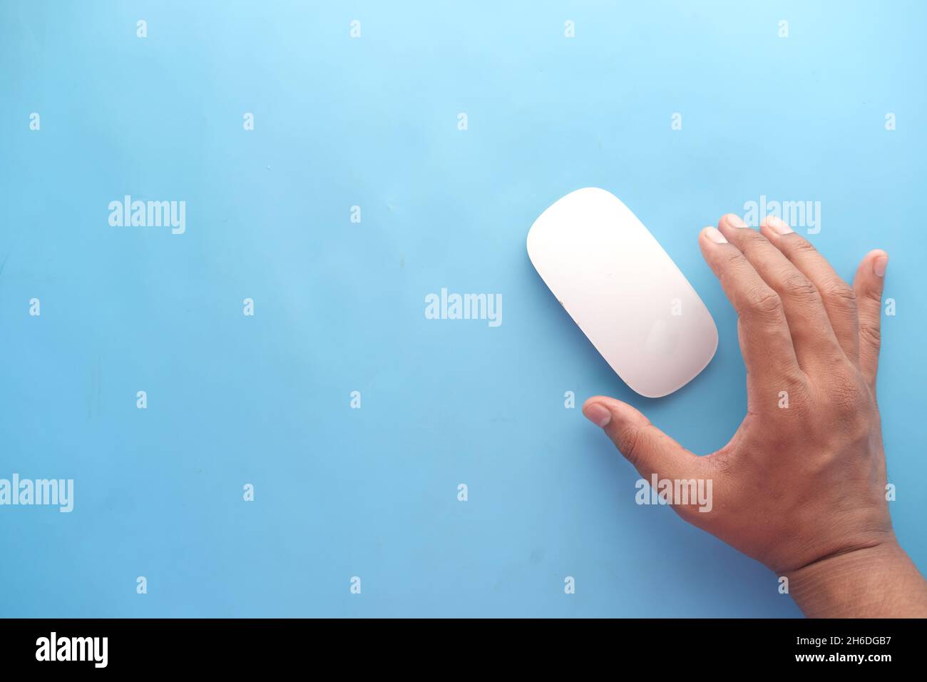 Businessman hand with computer mouse, Close up Stock Photo