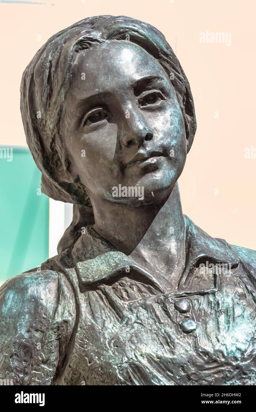 Part of (female likeness statue) the sculpture named  'Across Time and Space, Two Children of Toronto Meet' located in Bay Street in the downtown dist Stock Photo