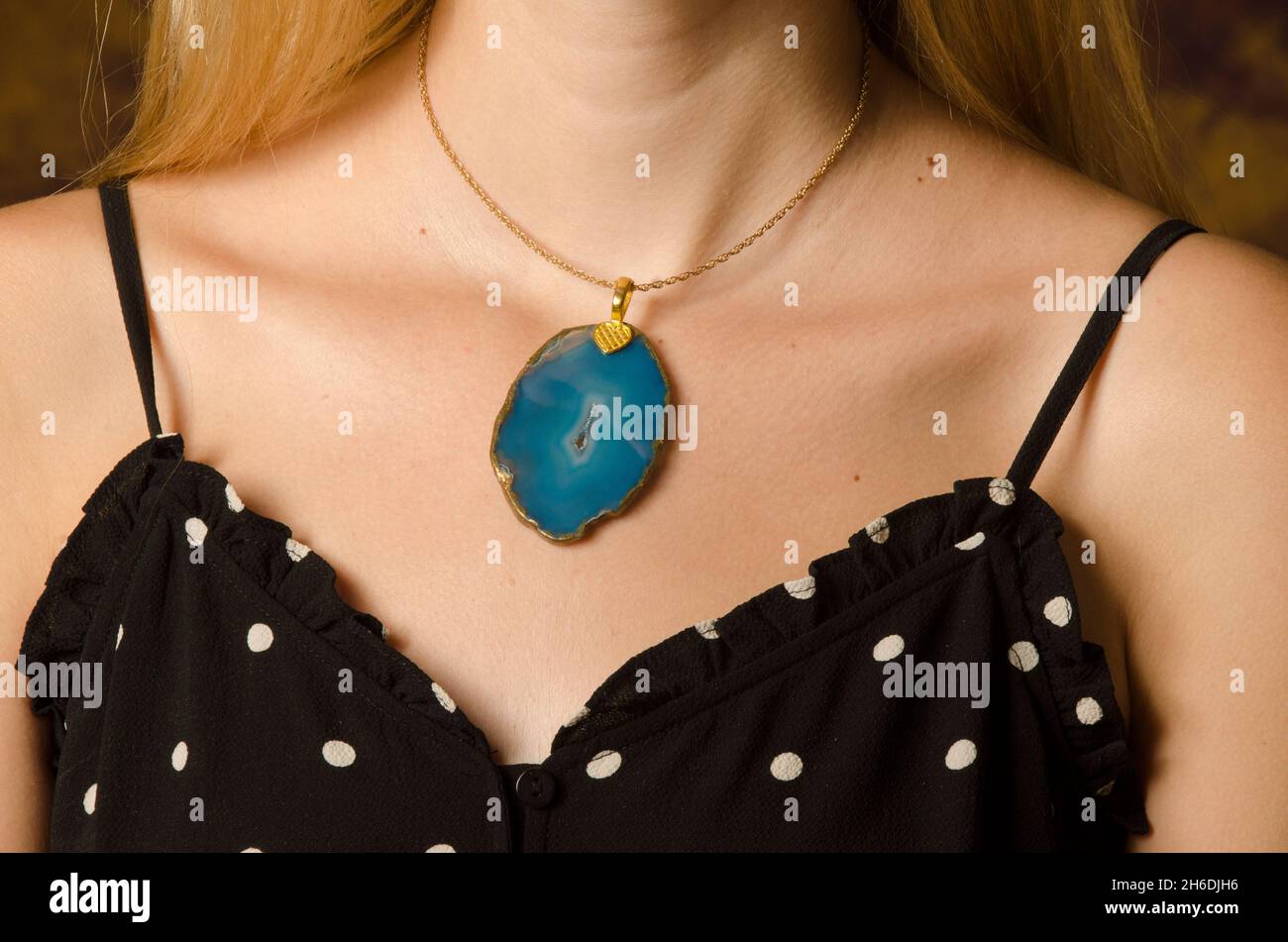 Handmade glass bead necklace around the neck of a female model Stock Photo