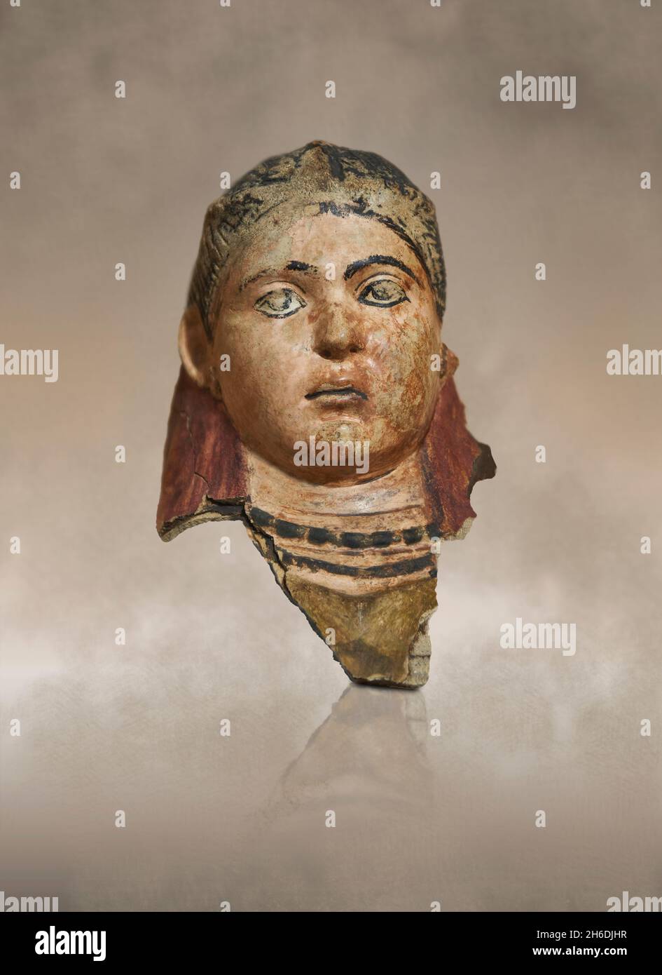 Roman Egyptian plaster funerary Mask, 100 - 150 AD, Cheikh Ibada, Antinopolis. Louvre Museum AF6704. Mummy portrait of a girl. The polychrome is parti Stock Photo