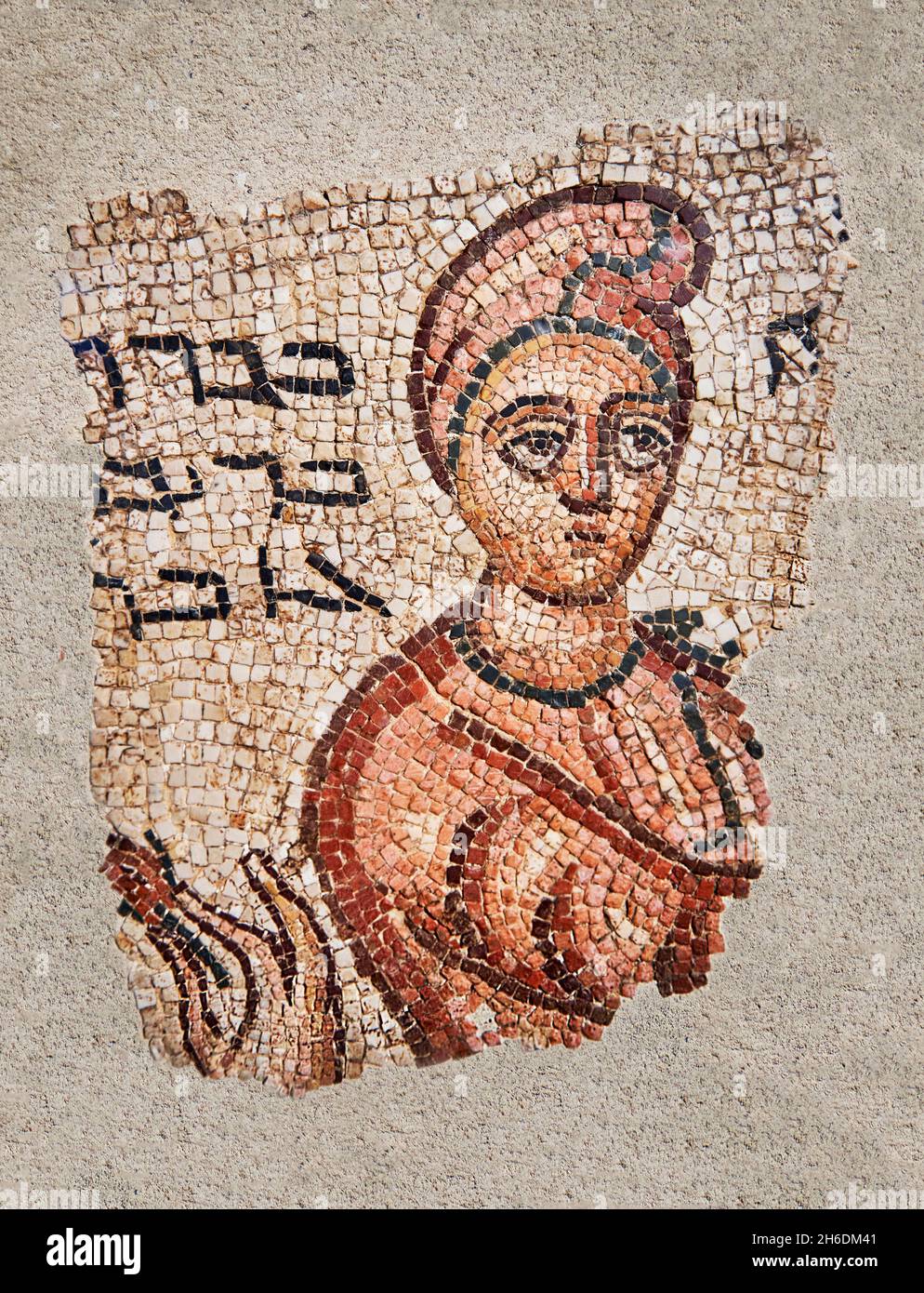 Roman Syrian funerary mosaic, 200 - 400 AD, North Syria. Louvre Museum AO 28293 .  Mosaic depicting a childs head with an inmscription in Aramean. The Stock Photo