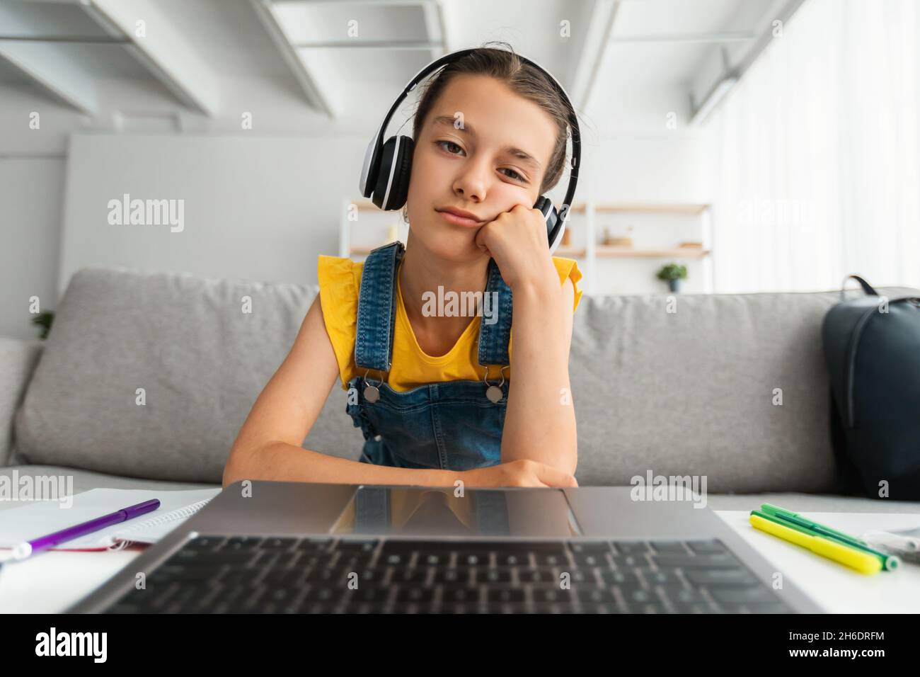 Bored school girl using pc view from webcam Stock Photo - Alamy