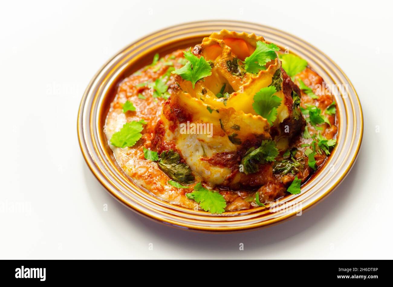 Hand rolled four cheese ravioli pasta in minced beef with Chianti red ...