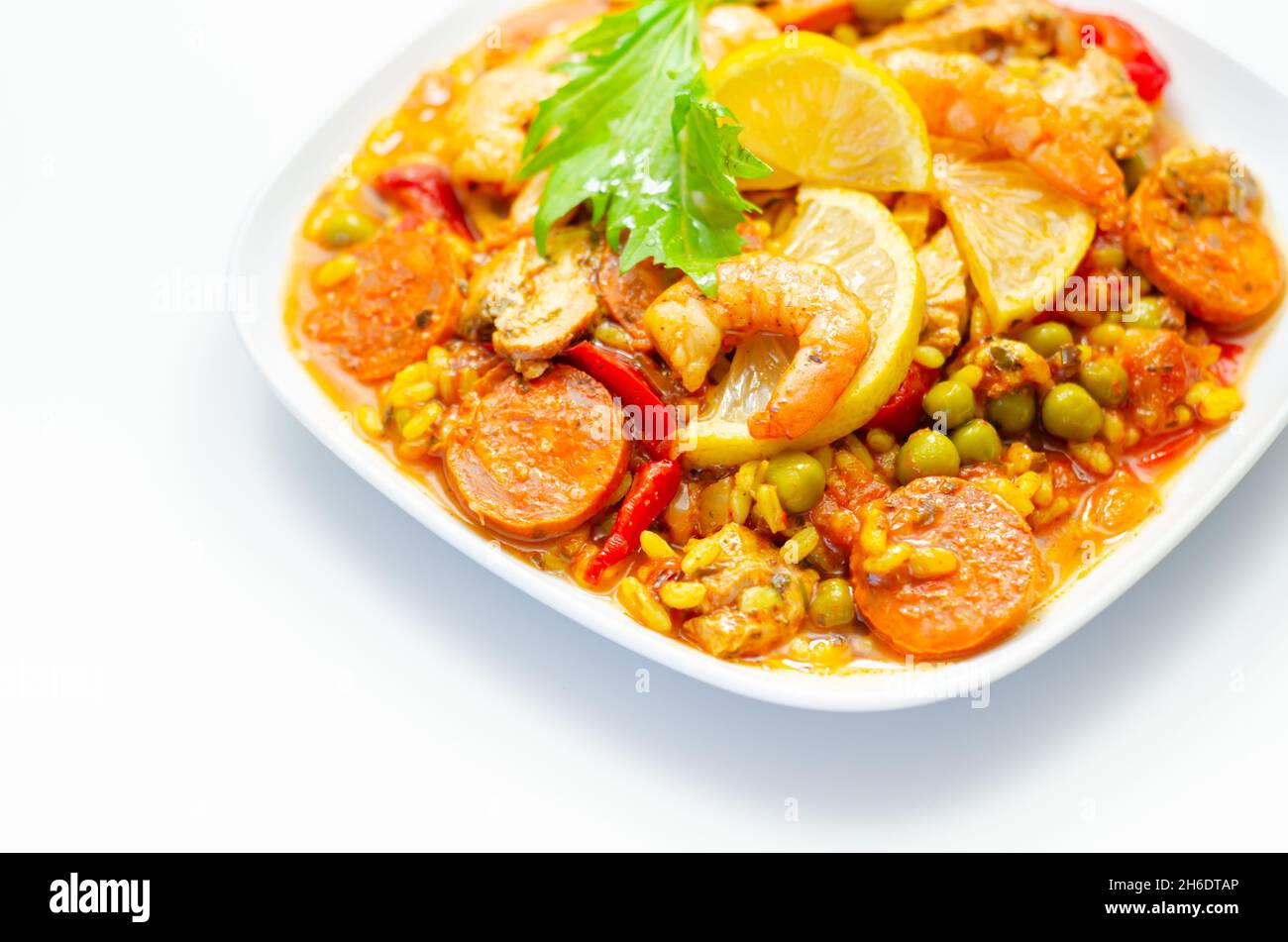 Delicious paella, cooked risotto rice with chicken thigh, king prawns