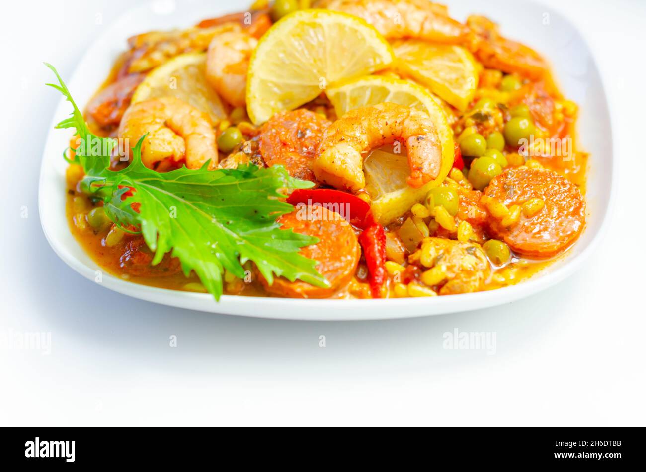 Delicious paella, cooked risotto rice with chicken thigh, king prawns