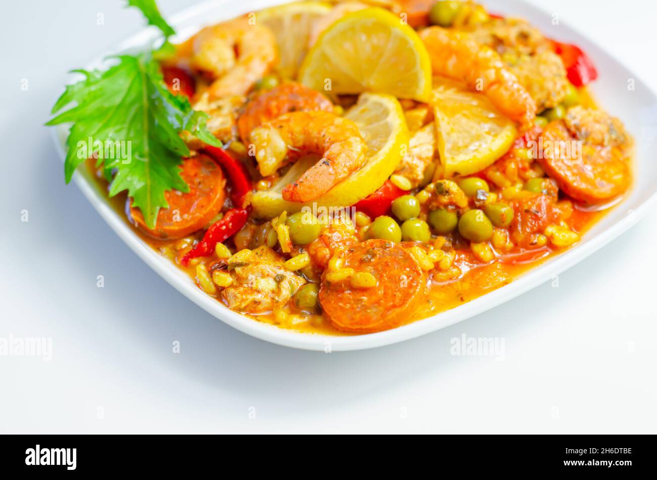 Delicious paella, cooked risotto rice with chicken thigh, king prawns