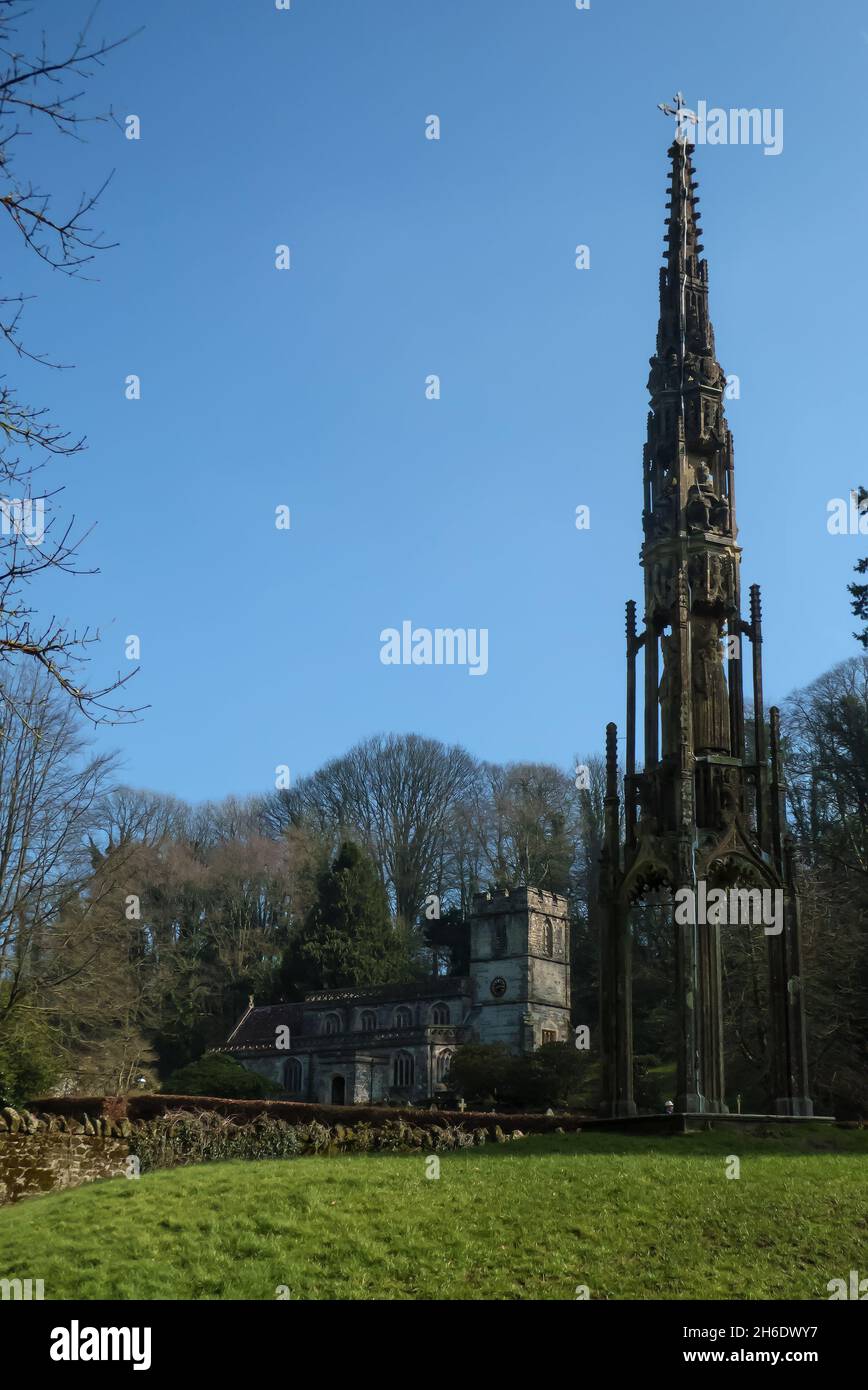 The medieval Gothic Bristol Cross and St Peter's church, Stourhead, Stourton, Wiltshire, England, UK Stock Photo