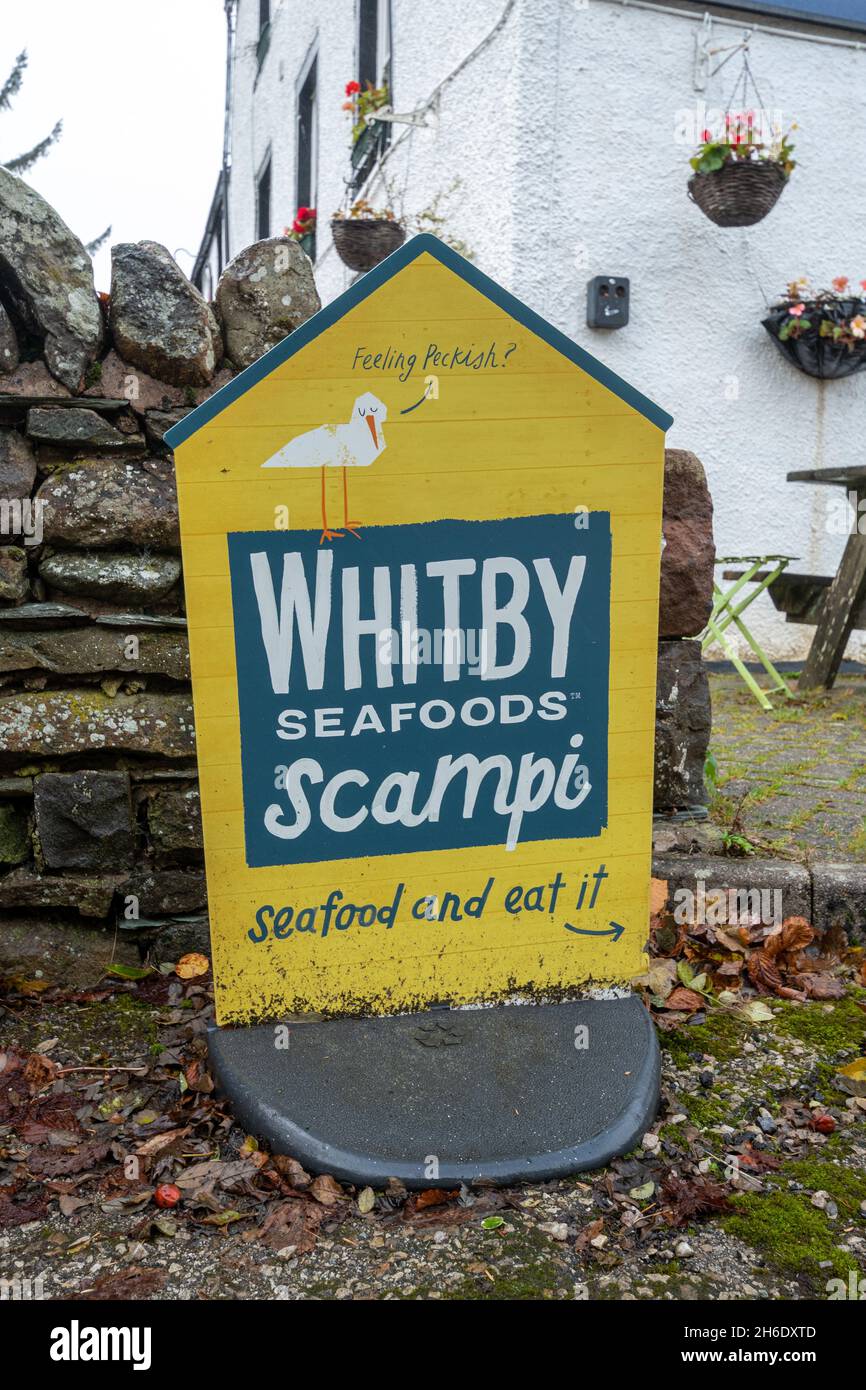 Whitby scampi seafoods advertising board or sign, UK Stock Photo