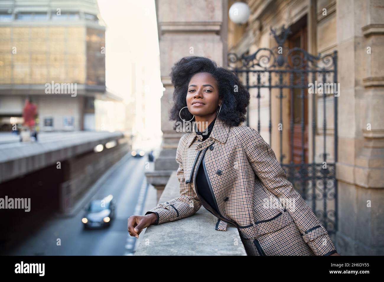 Beautiful African American young woman with afro and large hoop ...