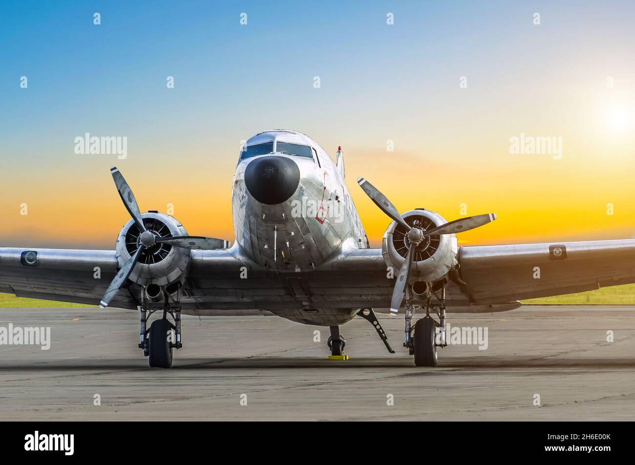 Old aircraft at sunset at the airport parking Stock Photo - Alamy