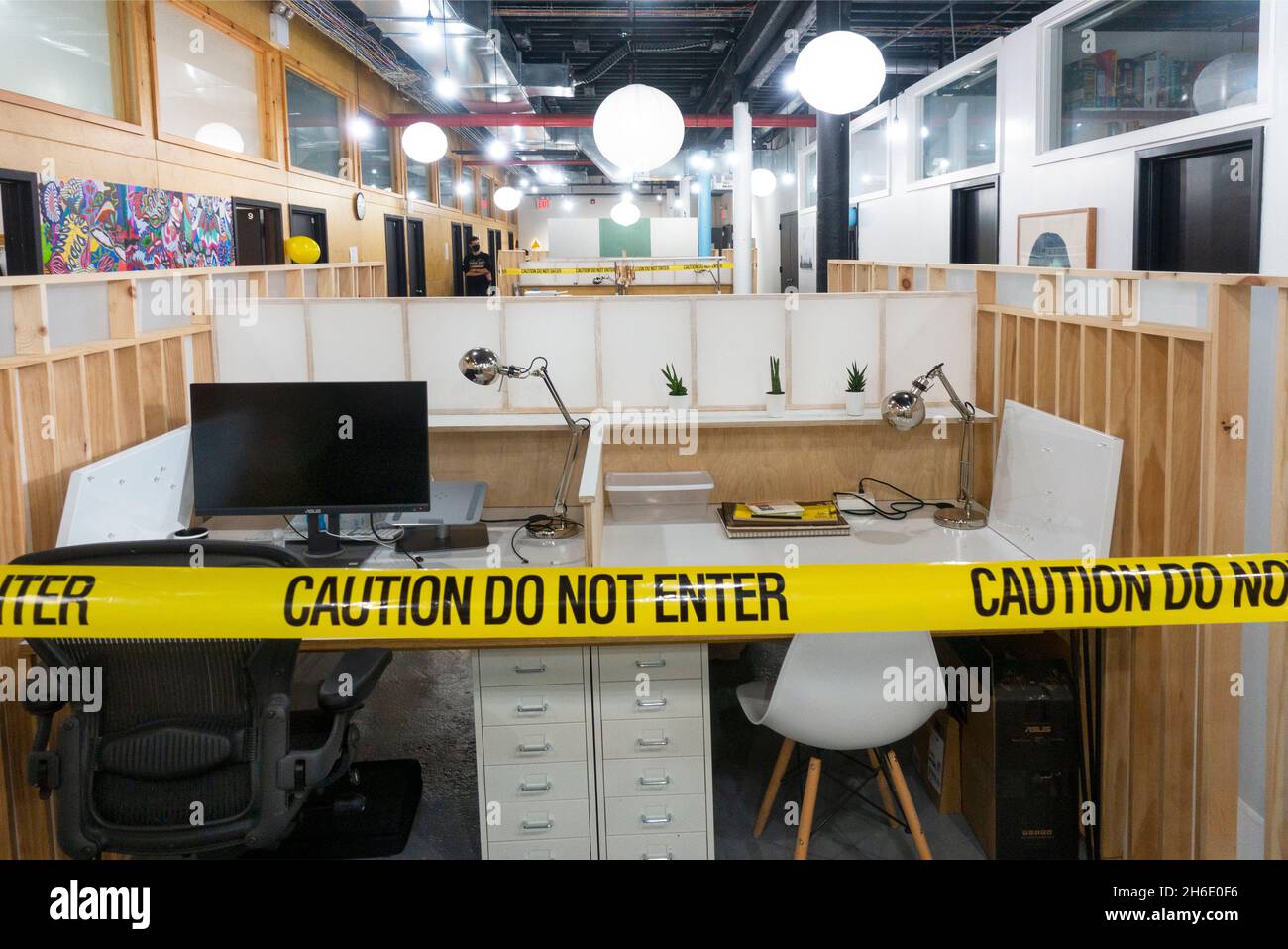 caution do not enter tape sign in co-sharing office in Brooklyn NYC Stock Photo
