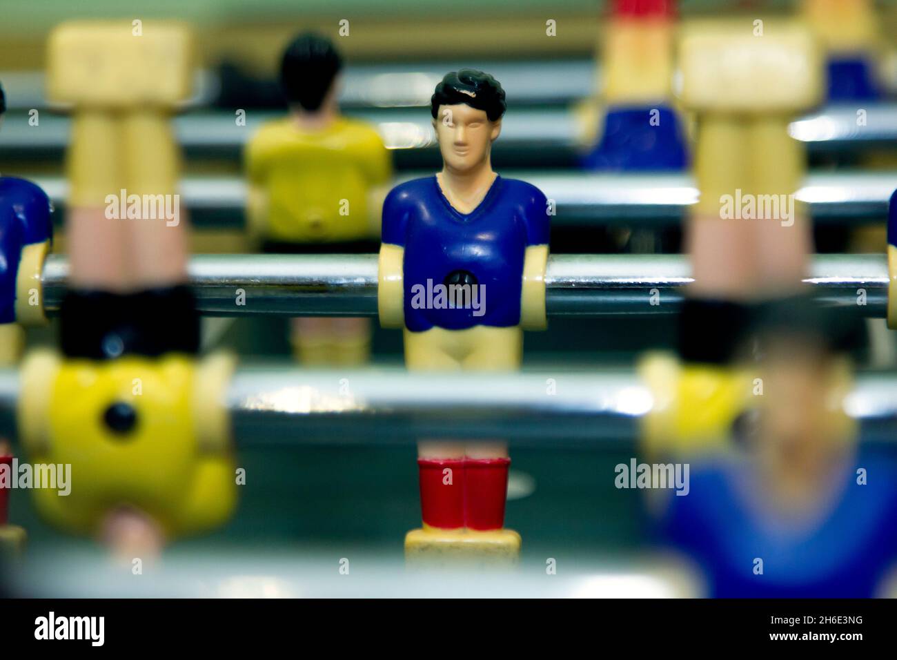 Close-up of a toy football player on the table football field Stock Photo