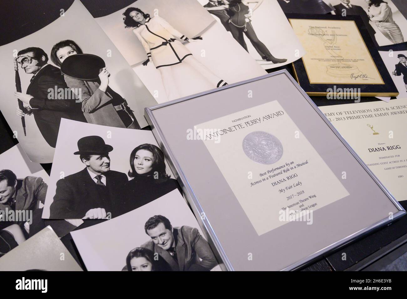 Bonhams, Knightsbridge, London, UK. 15 November 2021. Film, Rock & pop including property from the Estate of Dame Diana Rigg goes on sale at Bonhams on 17 November 2021. Image: The Avengers: A collection of vintage stills from The Avengers, 1960's, £1,000-2,000; (foreground) Diana Rigg: A Tony Award Nomination Certificate for My Fair Lady, 2018, £1,000-2,000. Credit: Malcolm Park/Alamy Live News. Stock Photo
