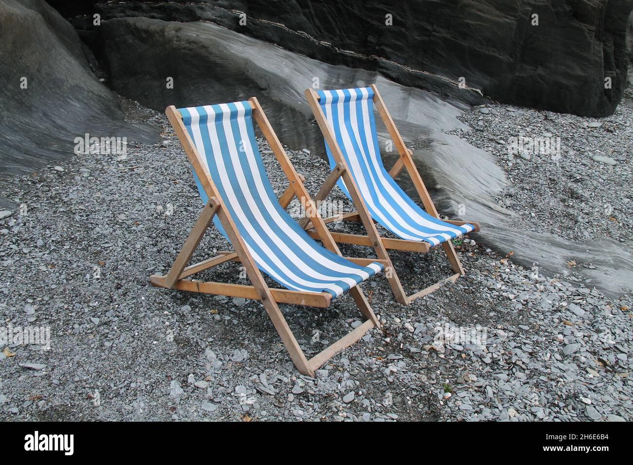 Two Deck Chairs on a Stony Seaside Beach Stock Photo - Alamy