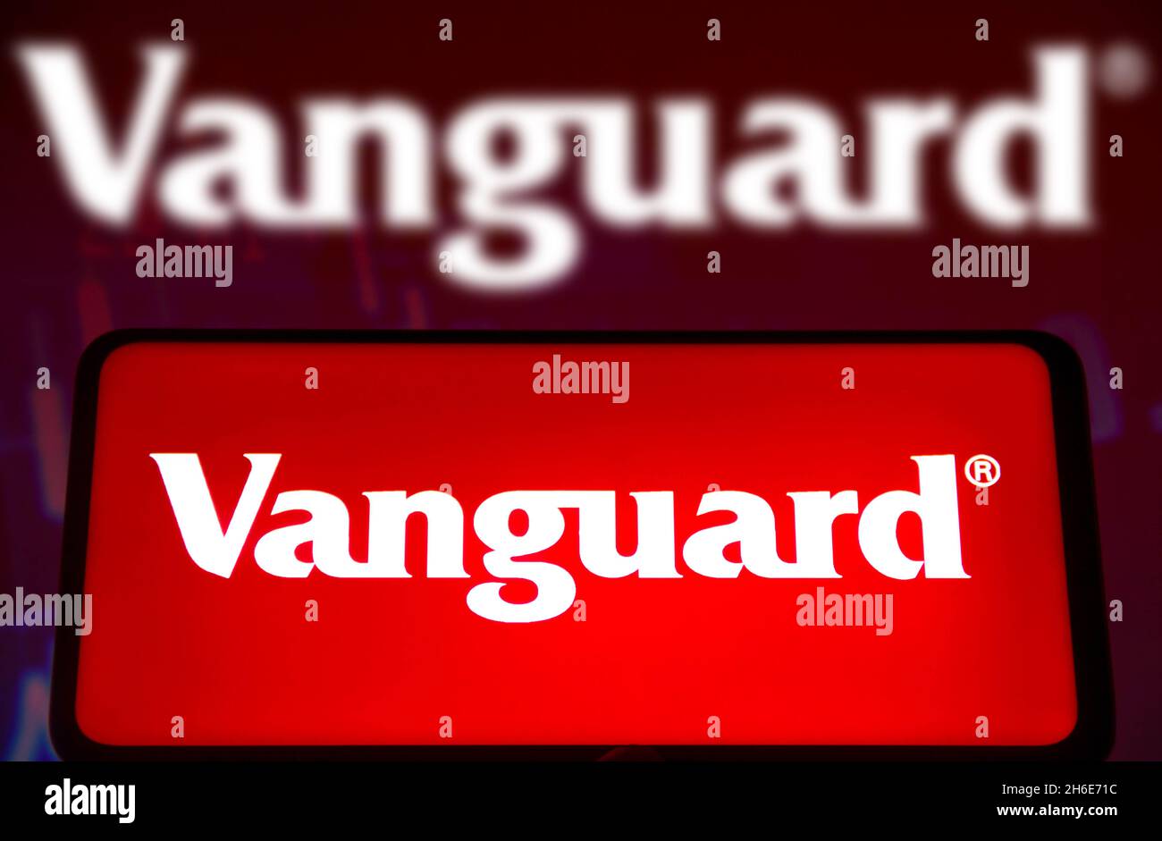 In this photo illustration a Vanguard Group logo seen displayed on a smartphone screen and in the background. Stock Photo