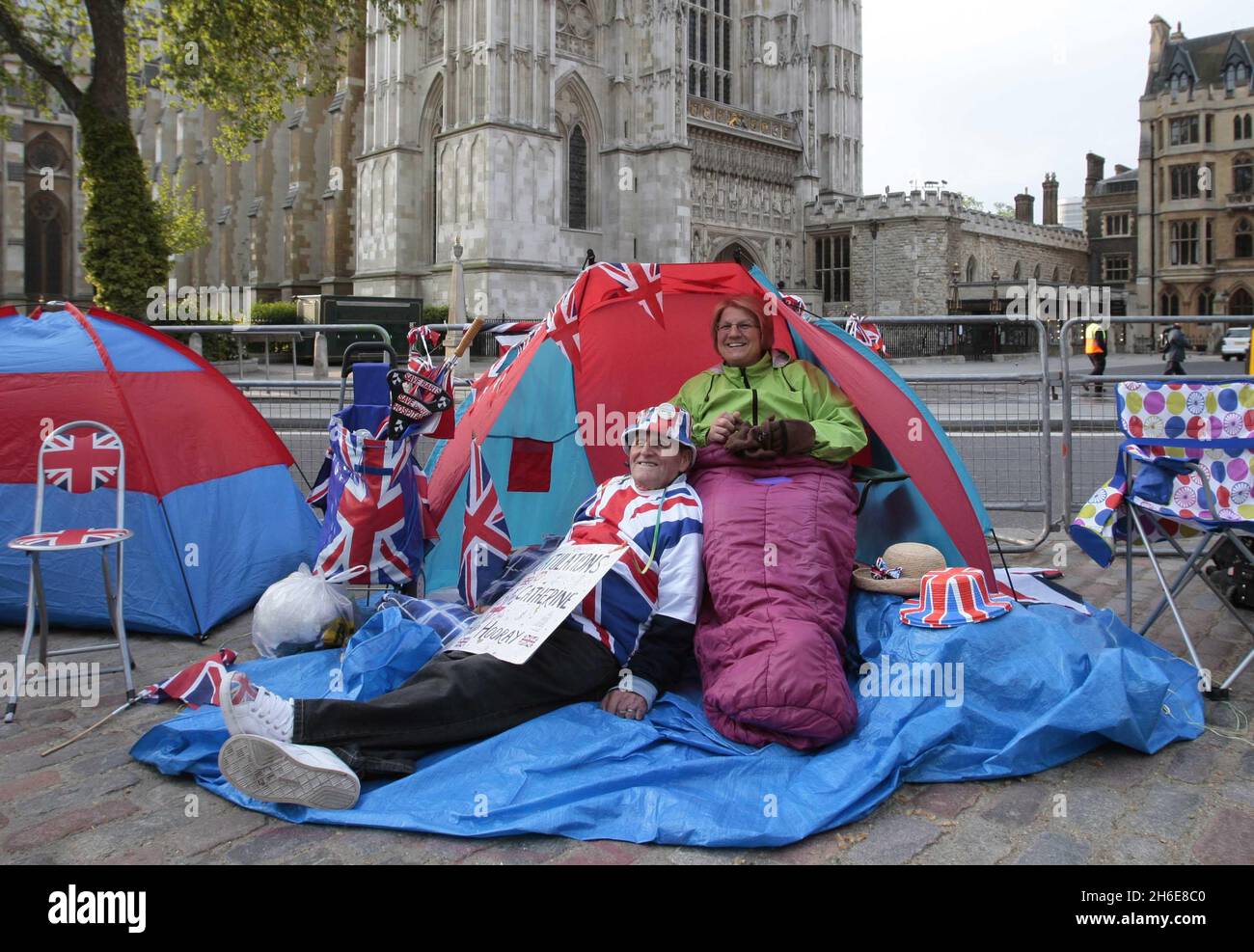 Terry Hutt and Jennifer Hawkins set up camp outside Westminster Abbey in London ahead of the Royal Wedding on Friday Stock Photo
