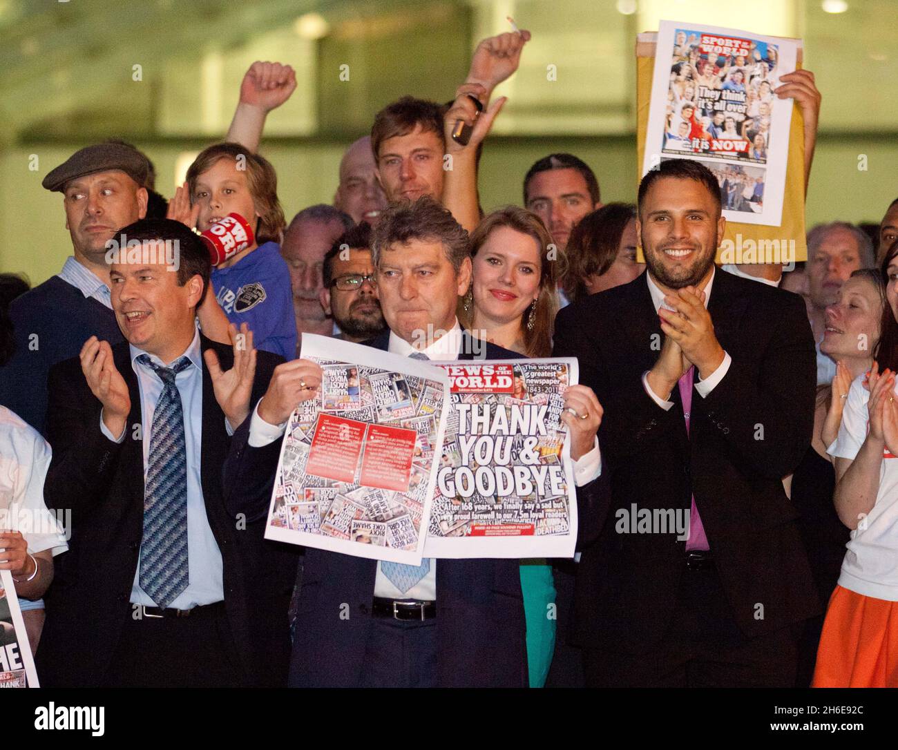 The NOTW editor Colin Myler holds the last edition of the paper outside ...