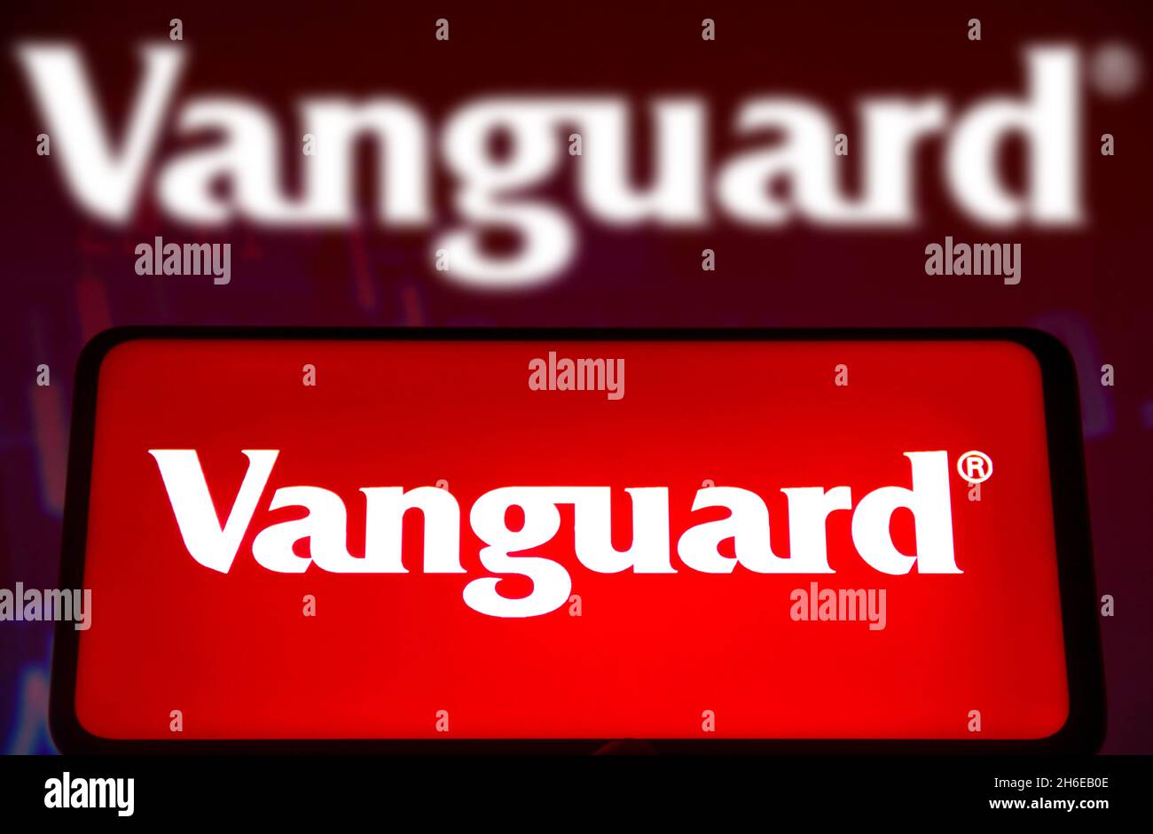 In this photo illustration a Vanguard Group logo seen displayed on a smartphone screen and in the background. (Photo by Rafael Henrique / SOPA Images/Sipa USA) Stock Photo