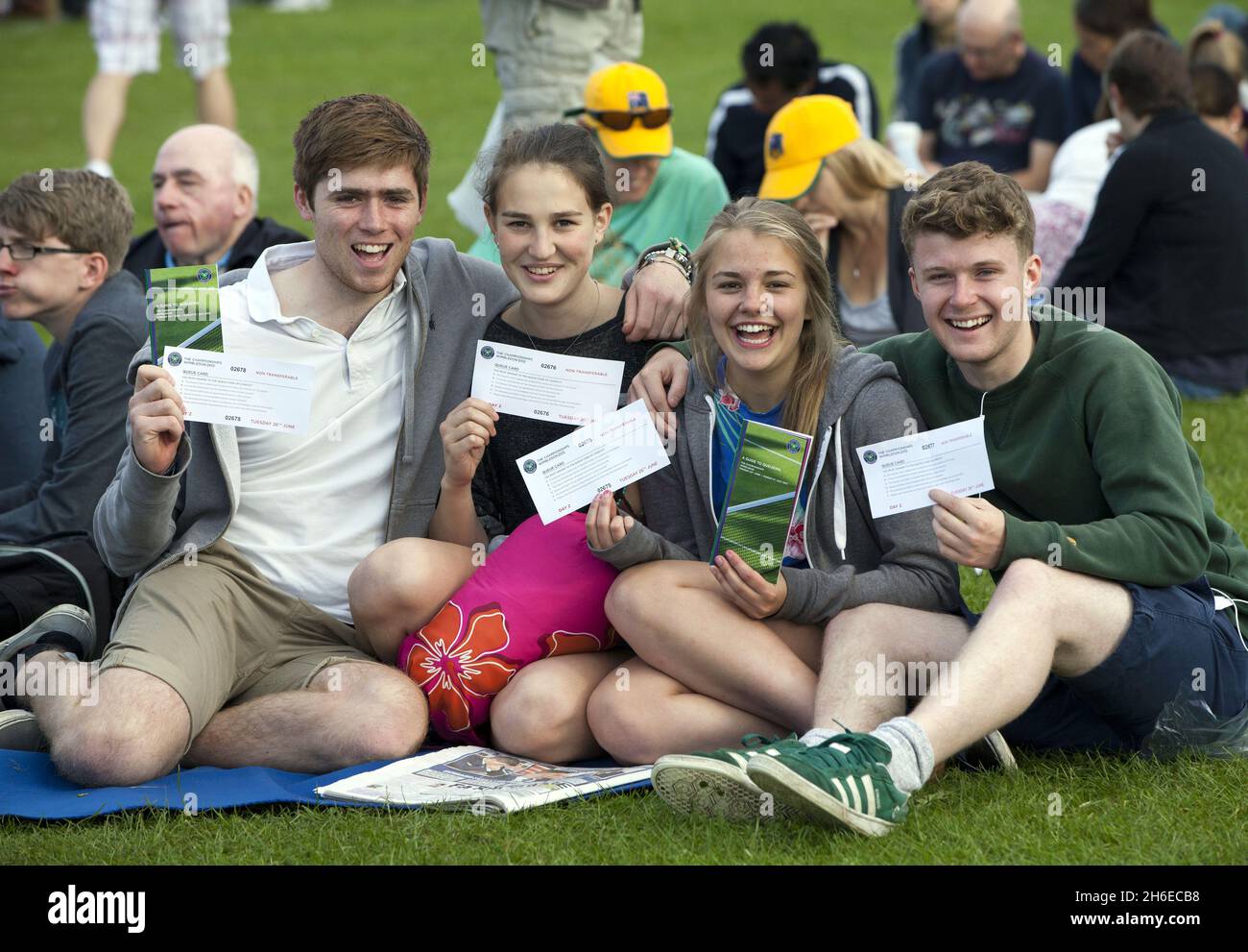 Andy Murray fans Laurence Dean, 17, Mel Beeston, 17, Sophie Taylormartin, 16, and Jonny Tunnacliffe 17 from Cambridge prepare for Andy Murrays Centre Court match during day 2 of Wimbledon. Stock Photo