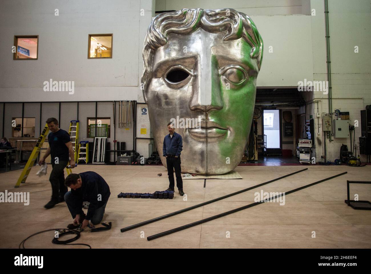 Finishes touches are made to the BAFTA stage set backstage at the Royal