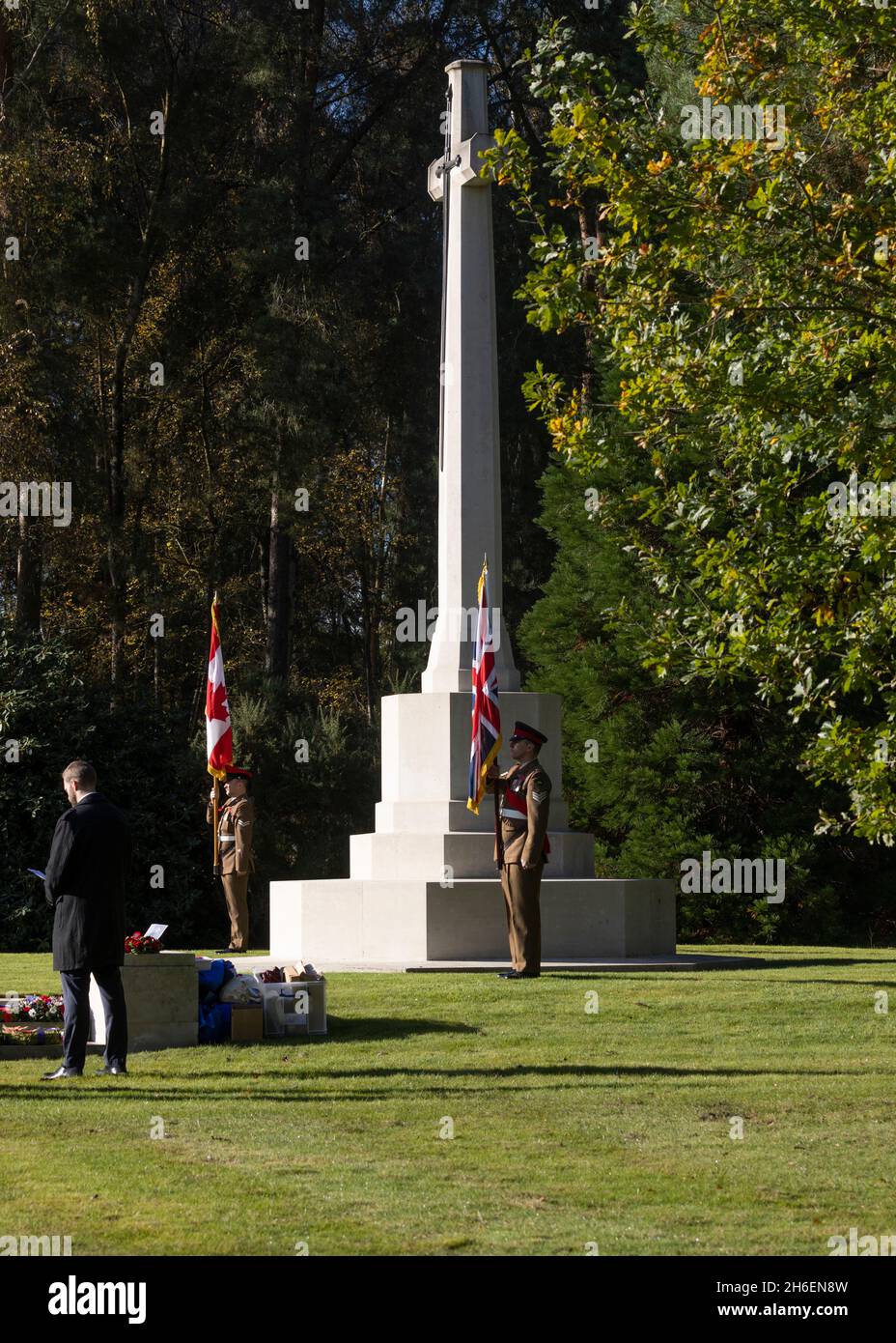 Standard bearers by the Cross of Sacrifice in the Canadian Section of Brookwood CWGC Cemetery on 11th November 2021 Stock Photo