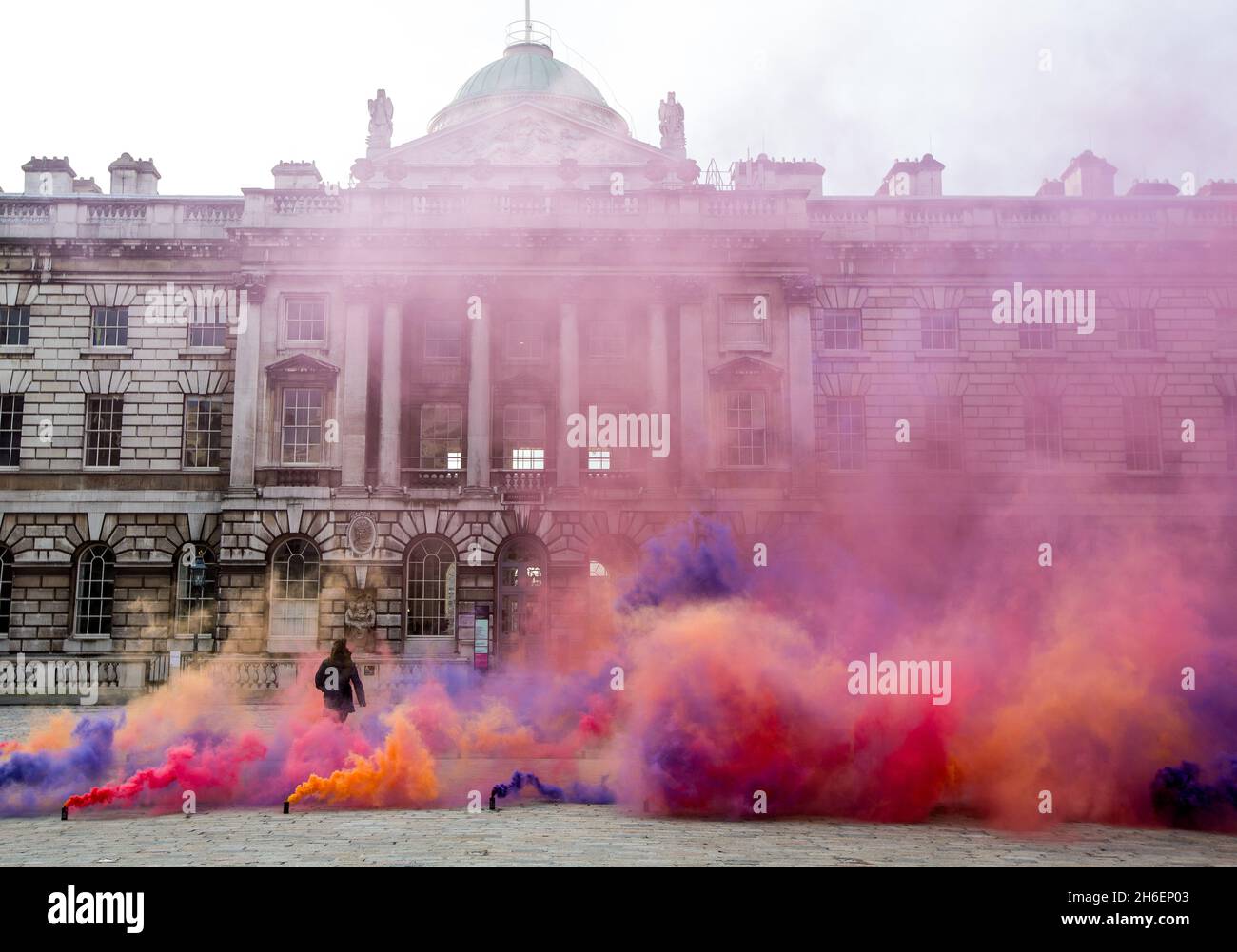Artist Filippo Minelli's Silence / Shapes ...  Letting off a series of colourful smoke bombs in Somerset Houseâ€™s courtyard in London  Filippo Minelli started the ongoing series Silence/Shapes to give a physical shape to silence. As medium he chose chemicals used to create smokebombs and to juxtapose them with the romantic idea of beauty of the natural landscapes.   Stock Photo