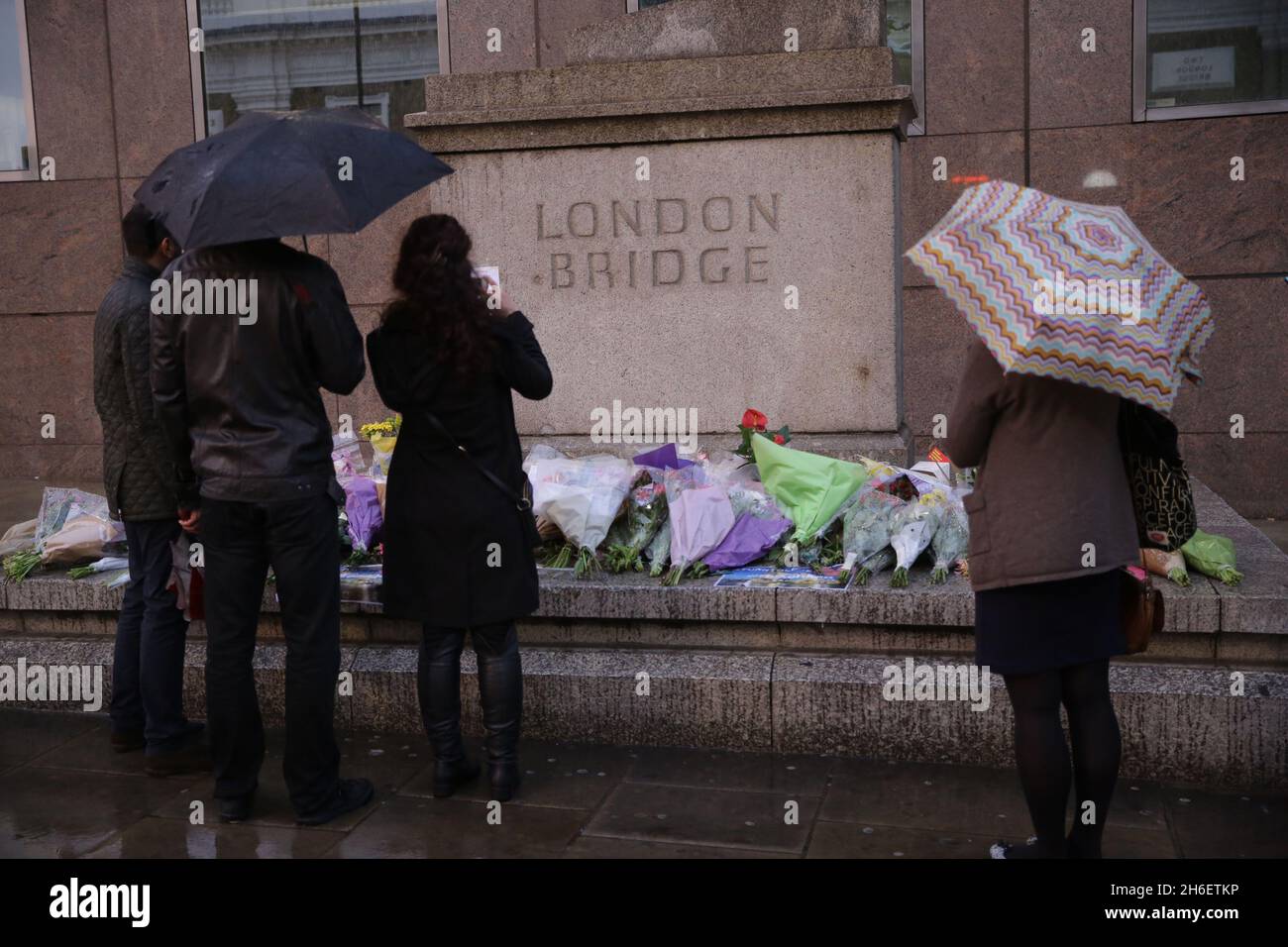 A poster, along with tributes, has been left on London Bridge by friends of a man called Sebastian who has been missing since the terror attack at the weekend. Stock Photo