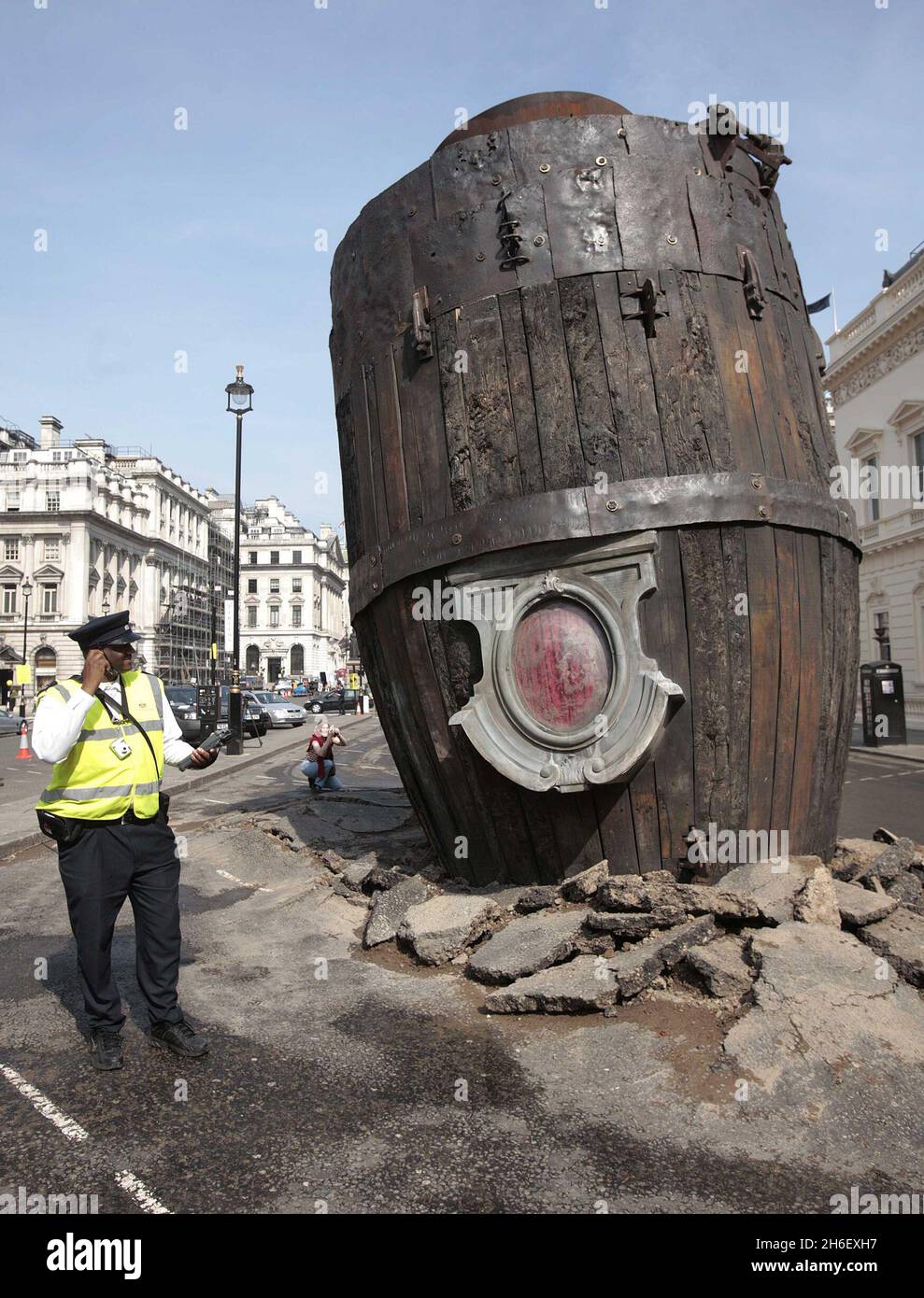 A giant smoking rocket was buried in the street in Waterloo place, London. Part of The Sultan's Elephant, a street theatre show by French company Royal De Luxe. Stock Photo