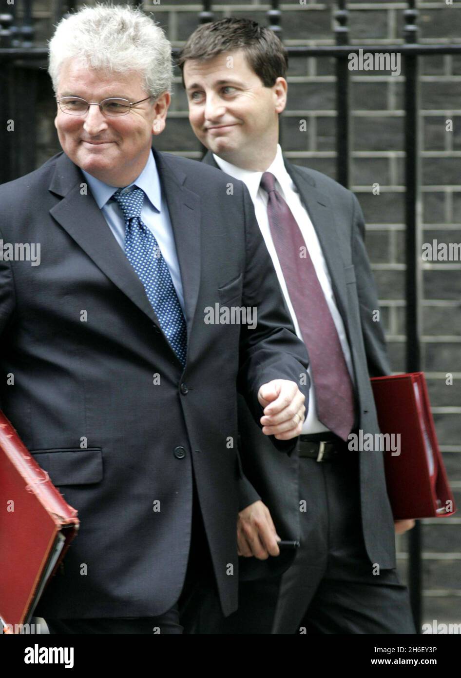Des Browne and Douglas Alexander leave the meeting on Downing Street in London. Jeff Moore/EMPICS Entertainment  Stock Photo
