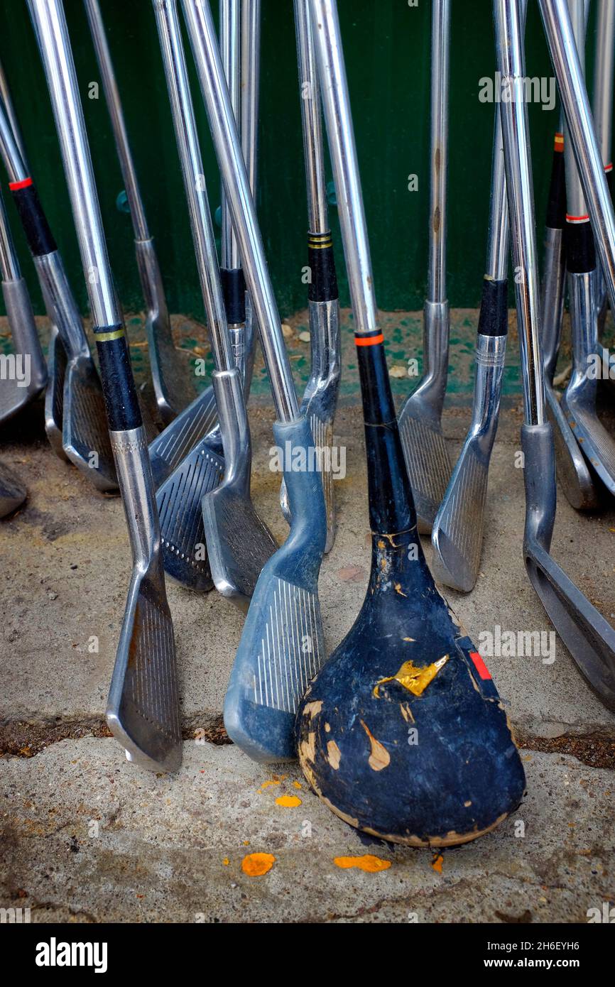 Old golf clubs leaning against wall Stock Photo Alamy