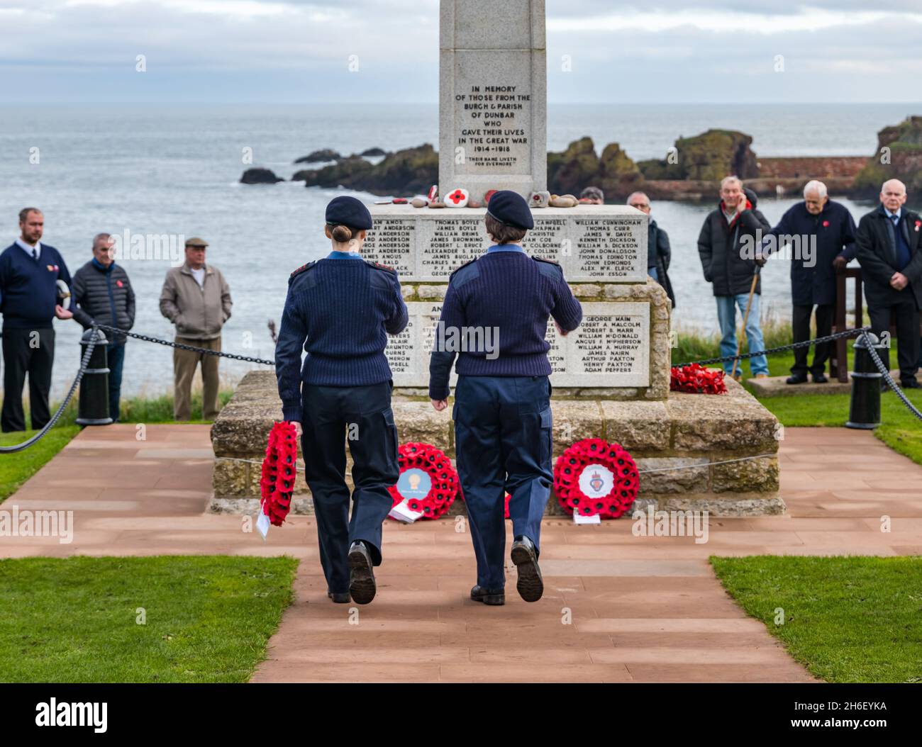 Cadets laying poppy wreath at war memorial in Remembrance Day ceremony, Dunbar, East Lothian, Scotland, UK Stock Photo
