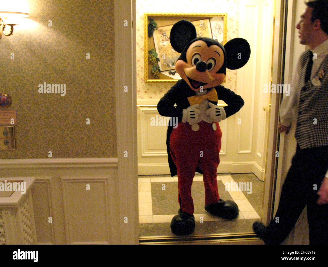 Mickey Mouse gets into the lift at the Disneyland hotel, during the Christmas celebrations at the Disneyland Resort in Paris. Stock Photo