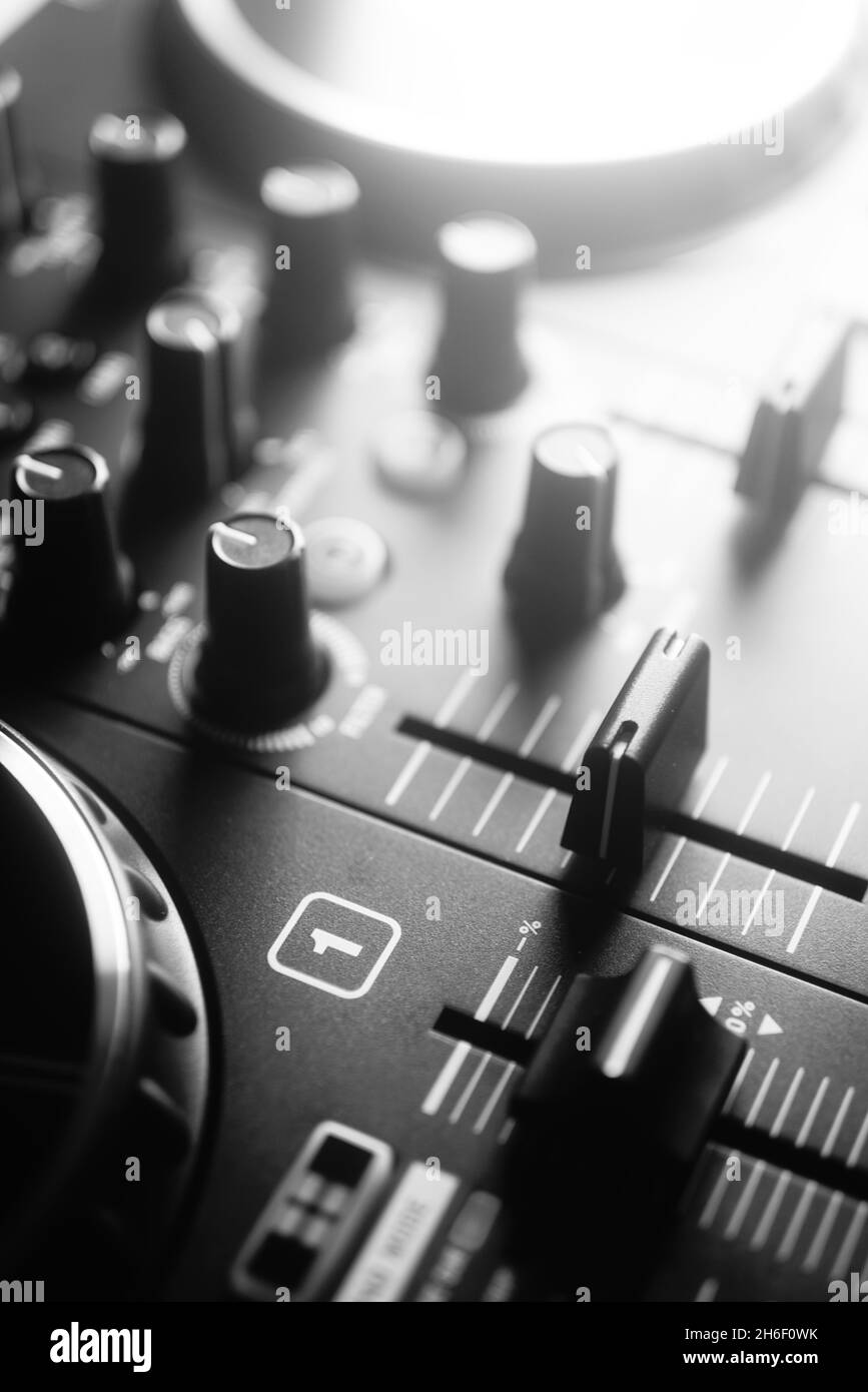 Deejay mixing desk black and white photo in house music
