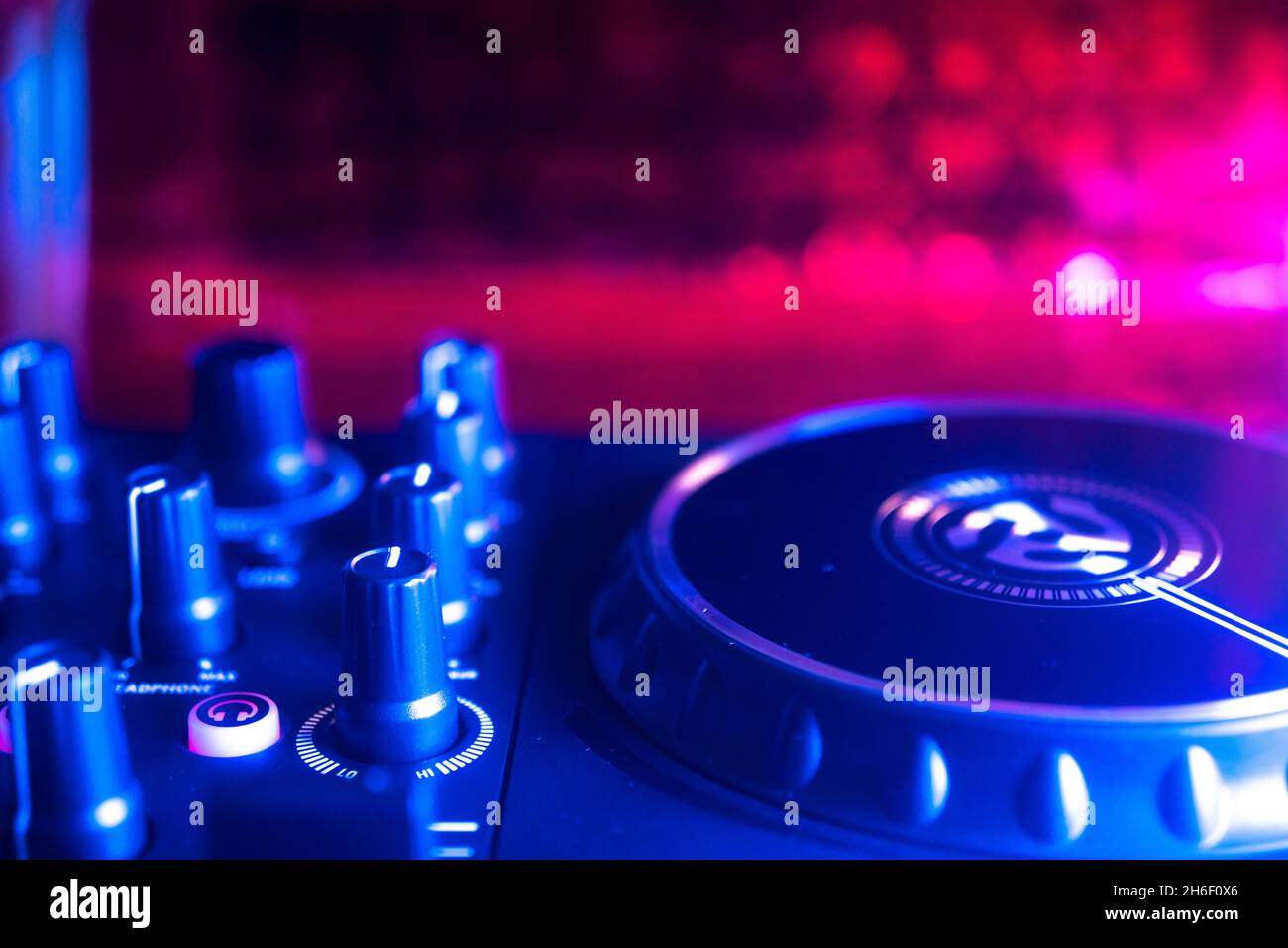 Dj turntables in electronic music house disco party lights